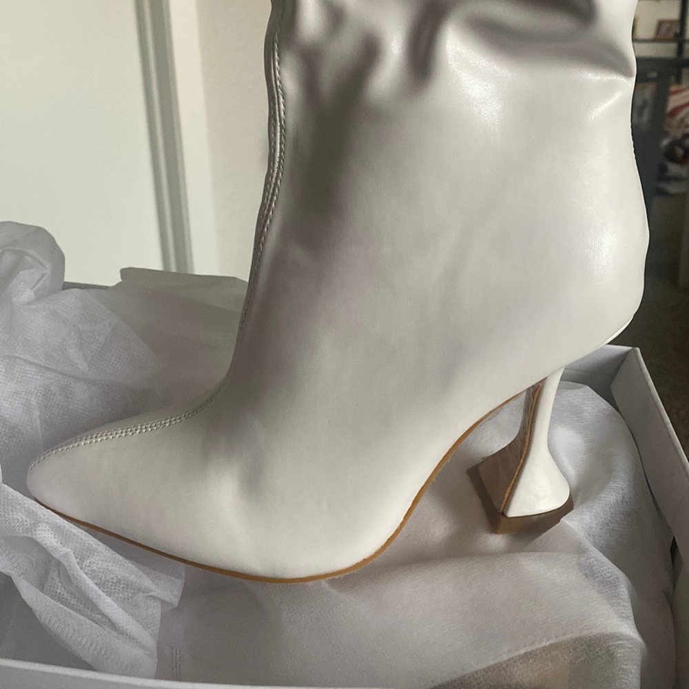 White thigh high boots.